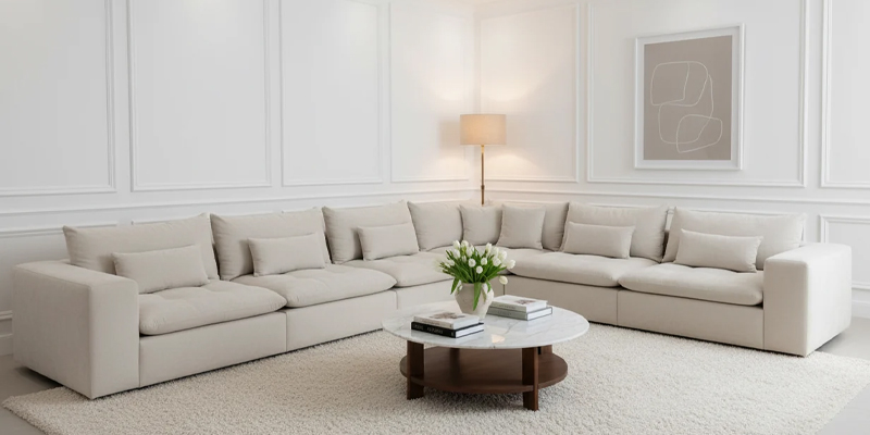 Custom made sofa in Dubai living room with fabric swatches and measuring tape